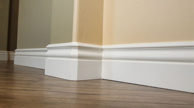 White baseboard along floor