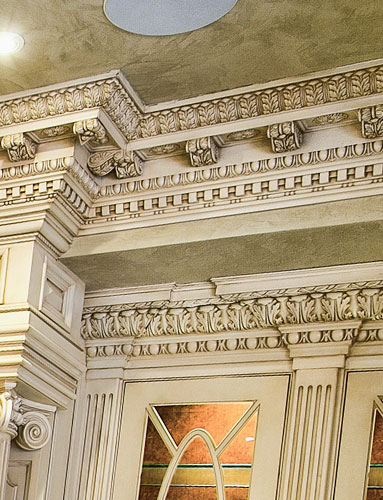 Ornate crown molding with antiqued finish