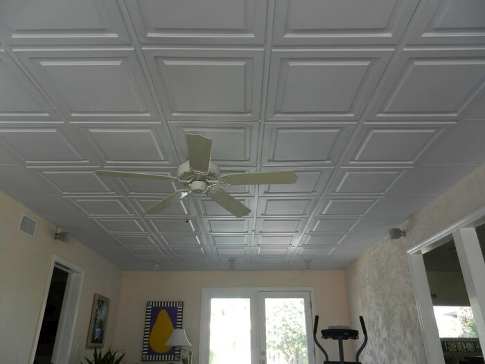Installation of 2x2 White Ceiling Tiles