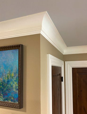 Crown molding installed on ceiling